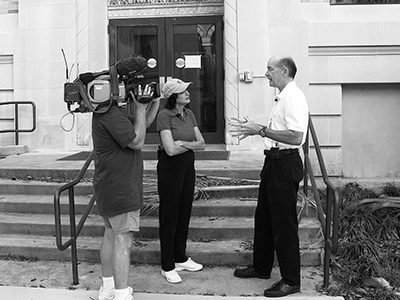 UTMB President Dr. David Callender speaks with a television news crew after Hurricane Ike in 2008.