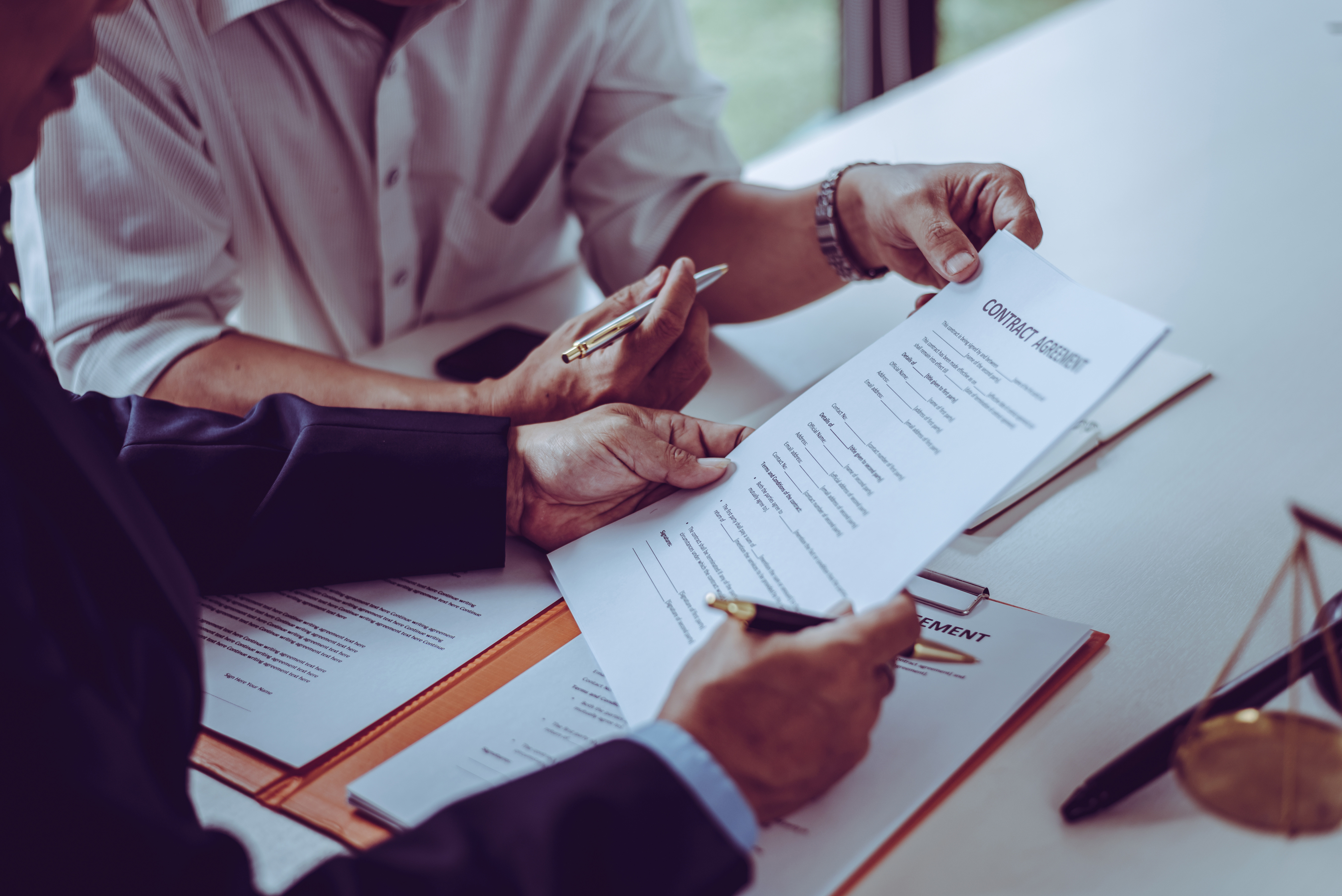 Two men discussing about a contract agreement