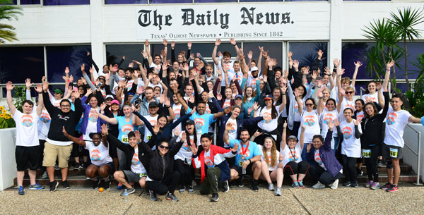 Large group of volunteers and race participants