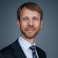 man wearing a tie and glasses