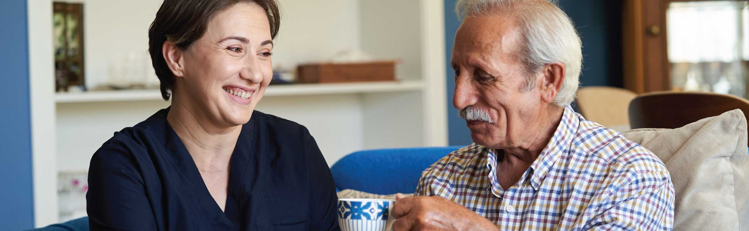 older man and woman, a family caregiver with a male patient