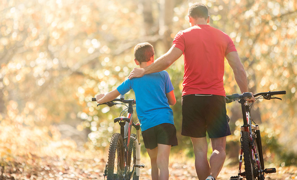 dad with son and bike