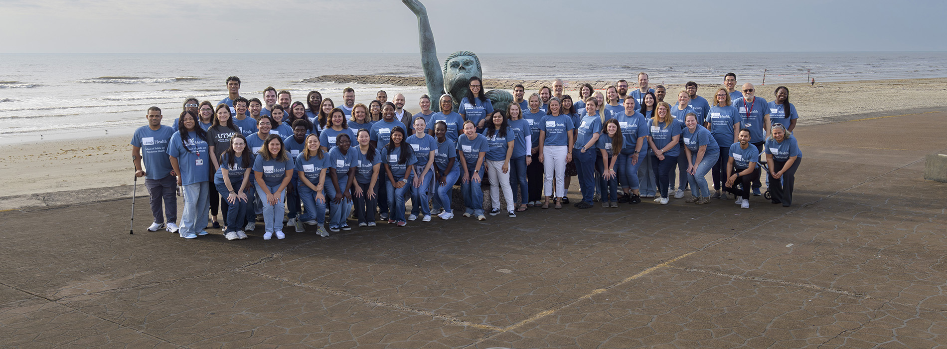 A large group of SPPH members by the 1900 Storm Memorial