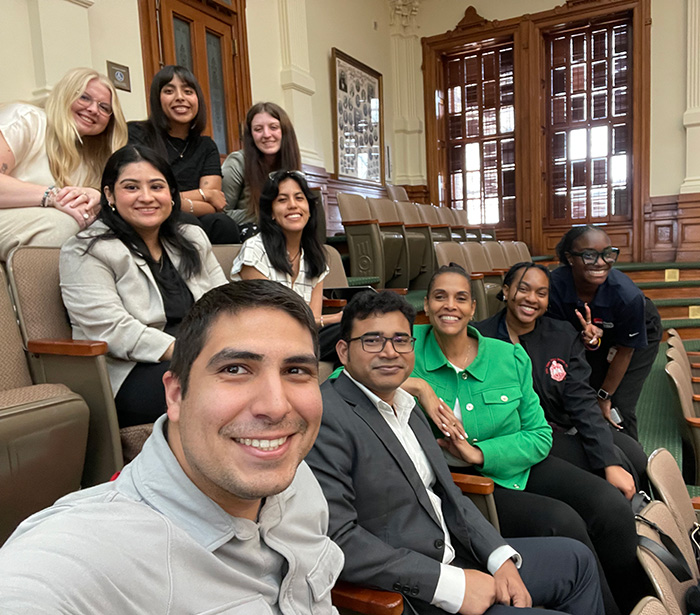 Students from the UTMB School of Public and Population Health gather for a group photo during an academic event.